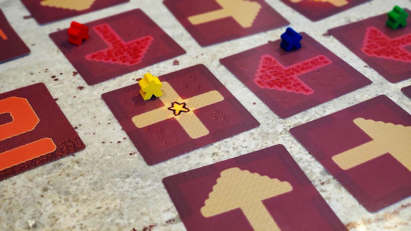 Meeples standing on cavern tiles ready to excavate